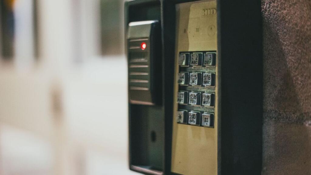 A card reader and keypad on a commercial wall